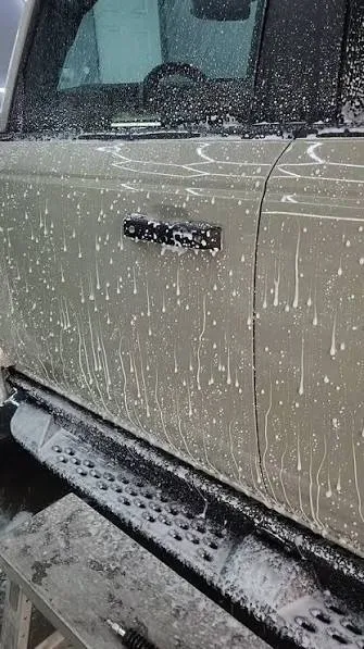 Water beading down the door of a coated truck