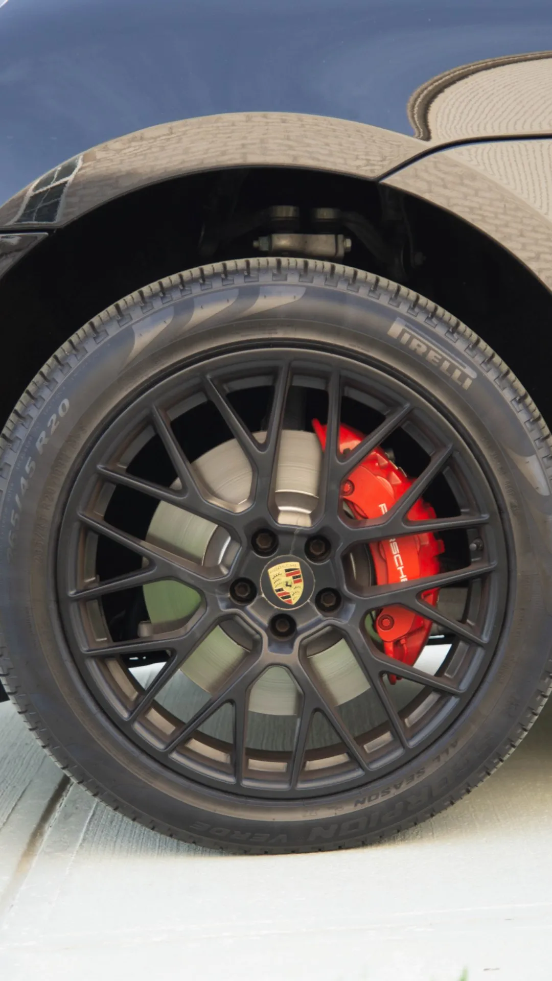 Porsche wheel and caliper before detailing